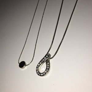 two silver necklaces